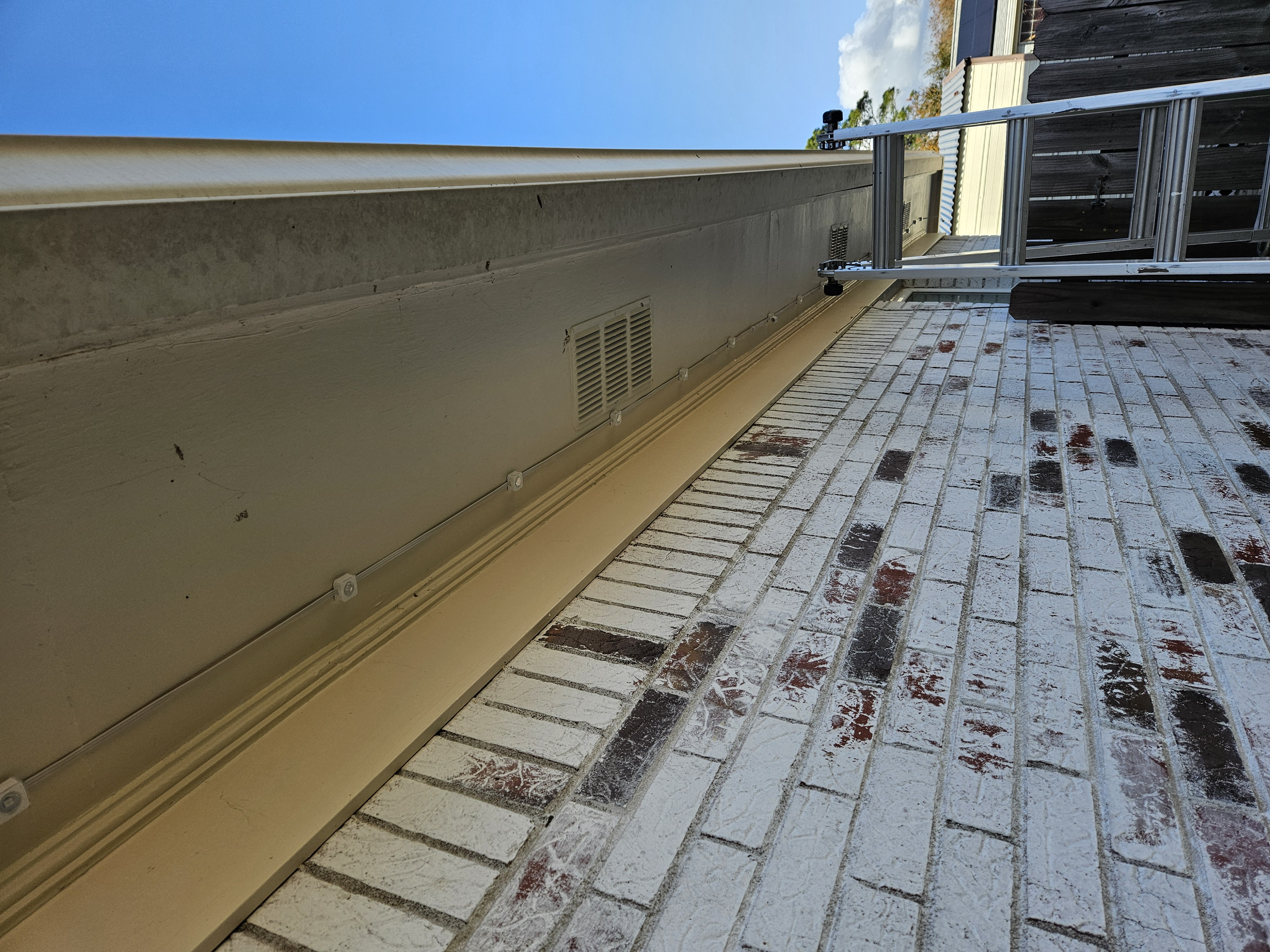 Close-up of my Govee permanent outdoor light modules and cable installed under the house eave