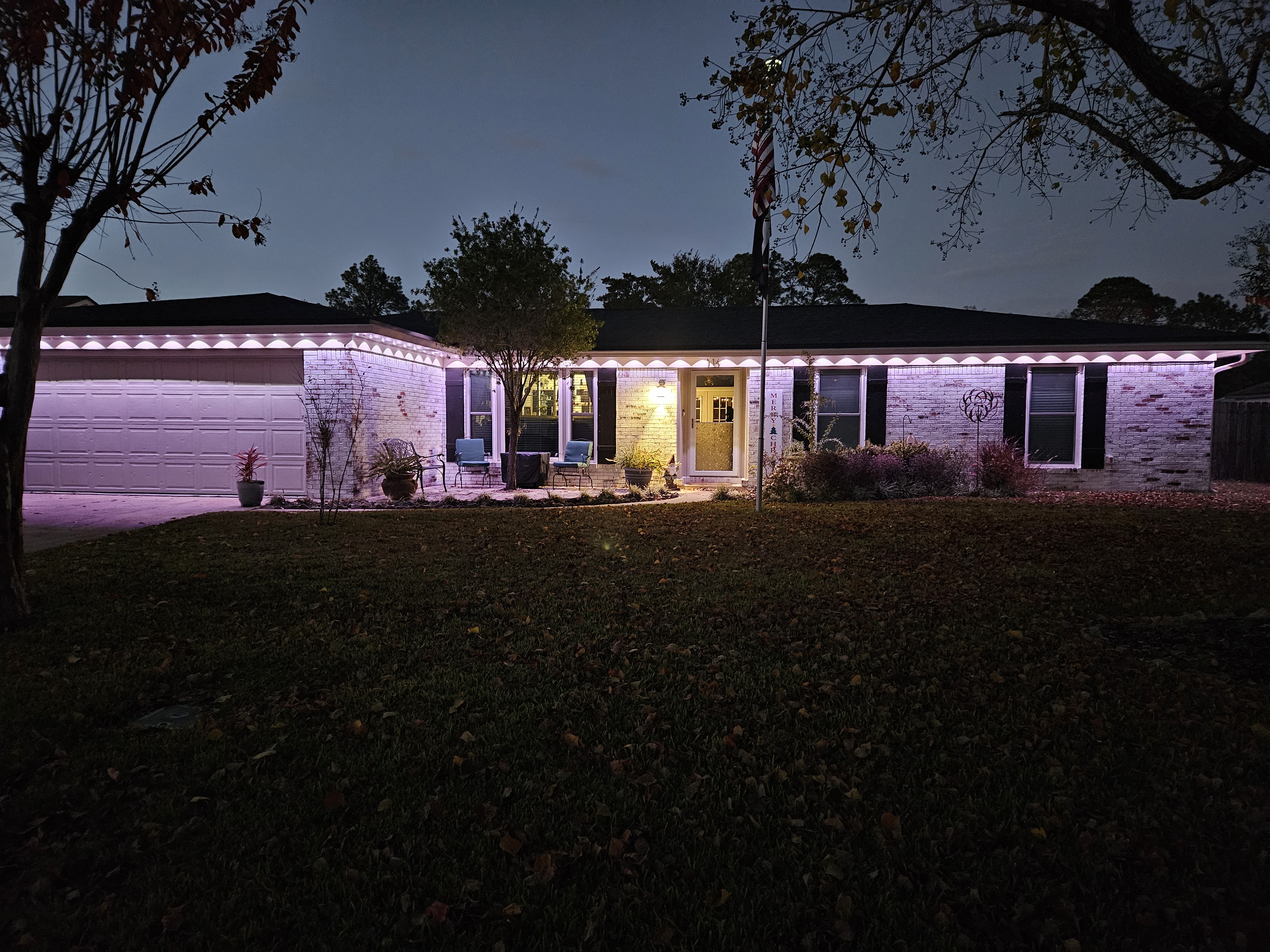 My home at night illuminated by Govee permanent outdoor lights mounted along the roofline